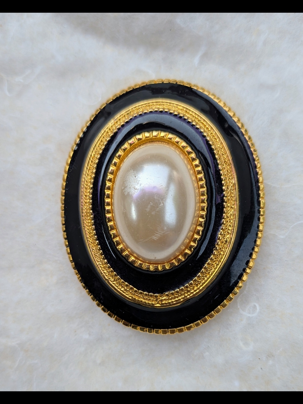 Black and Gold Oval Brooch with Central Pearl Accent